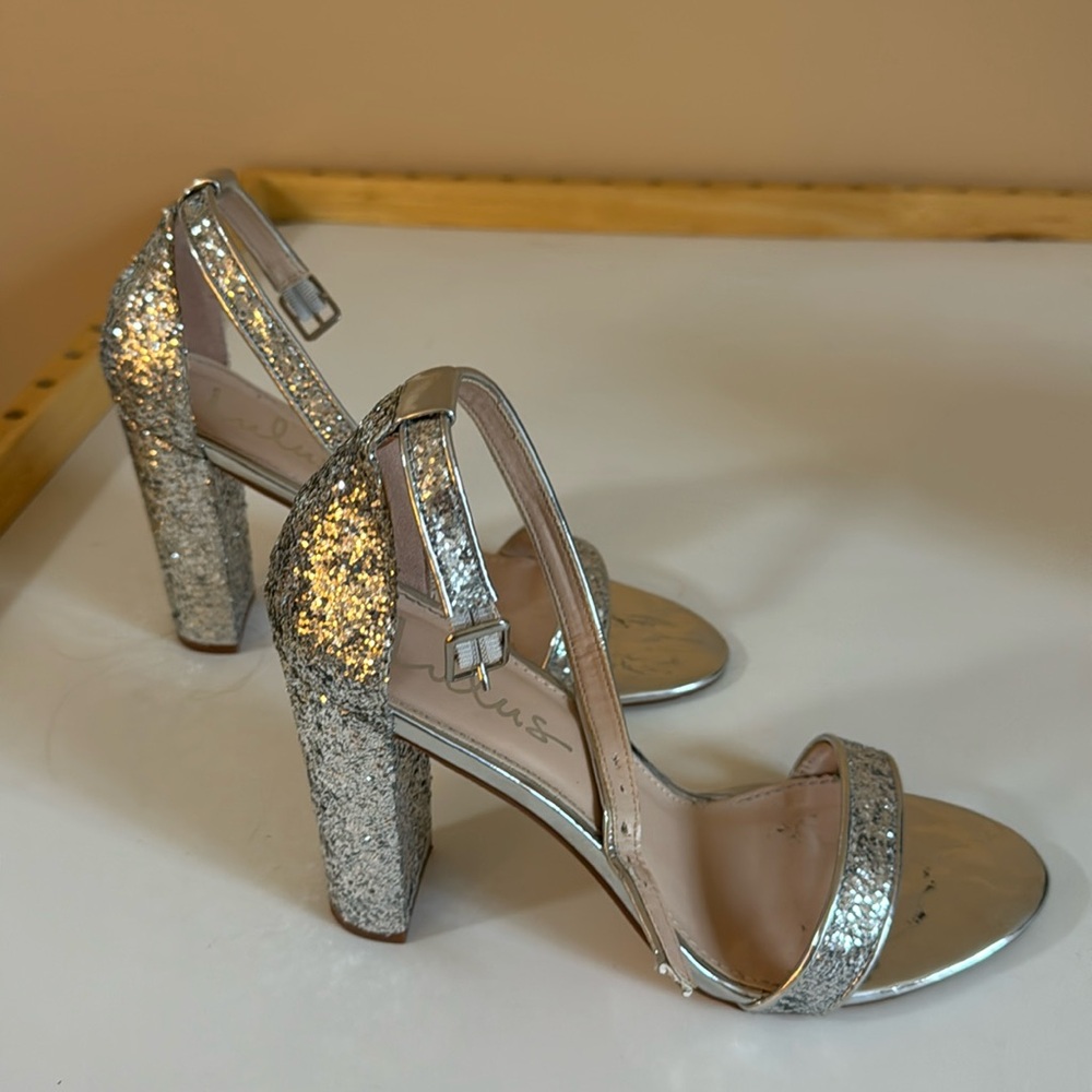 Silver sequined heels. 4” heels. Used 1 time.